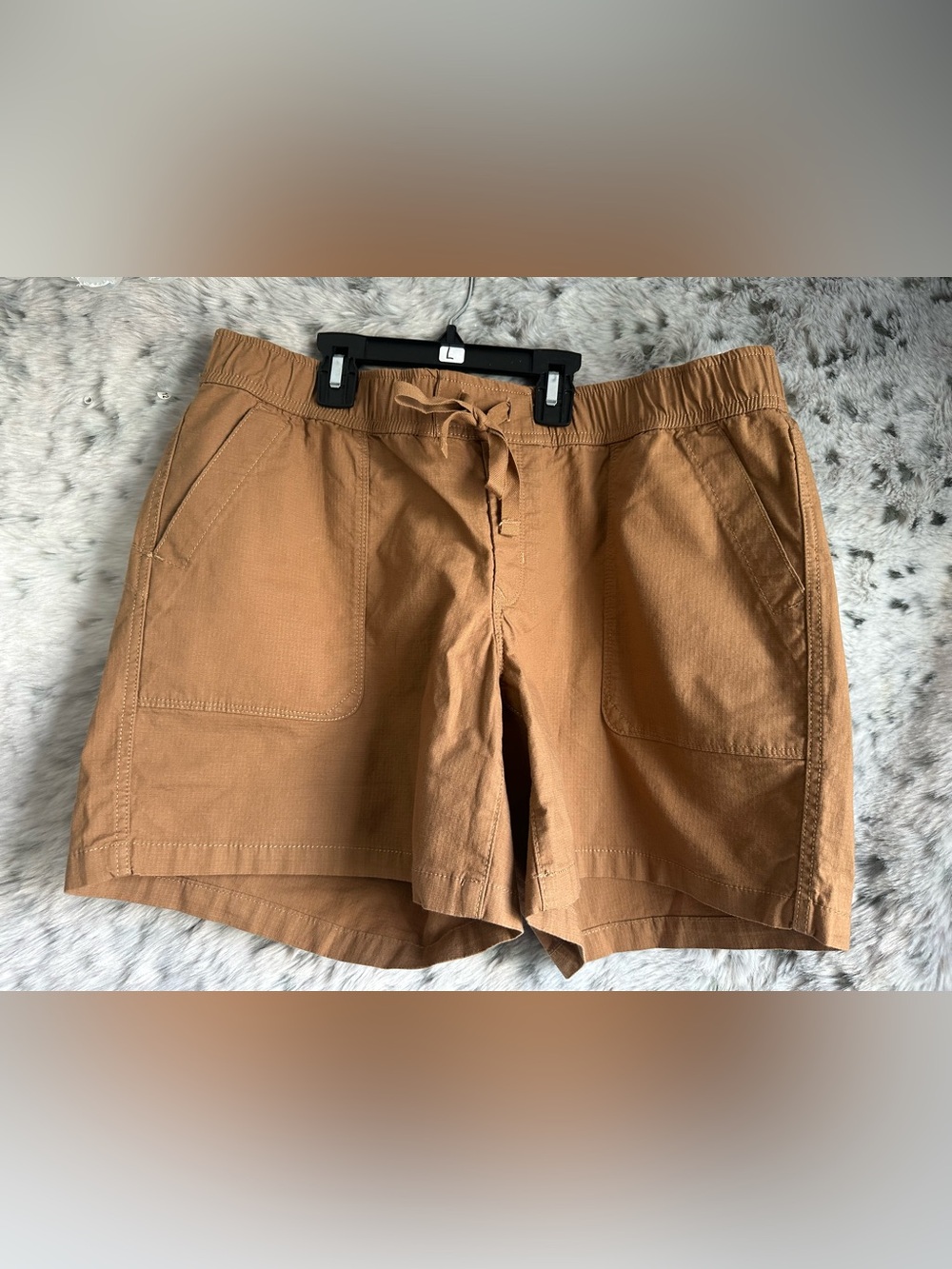 63.  Northface women’s large shorts brown